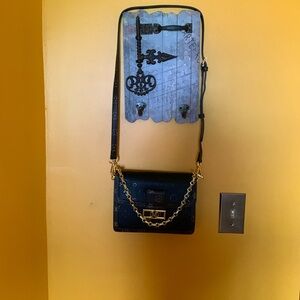 Hard shell style crossbody bag.